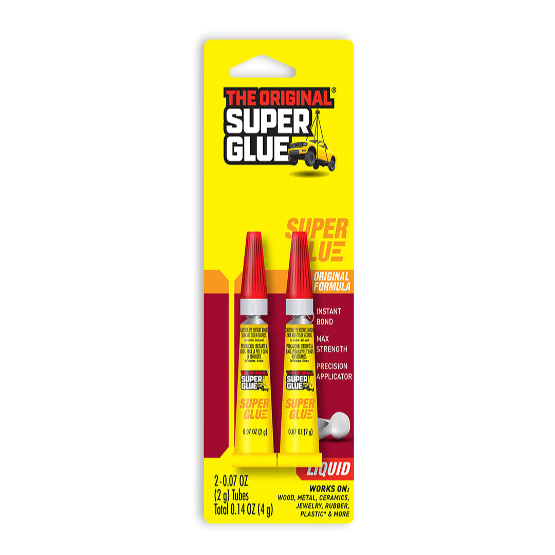 Super Glue packaging with two red tubes on a yellow background